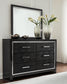 Kaydell King Upholstered Panel Storage Bed with Mirrored Dresser